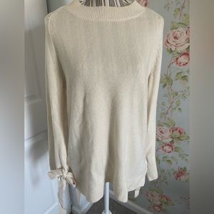 Cute tunic style sweater with bell bow tie sleeves